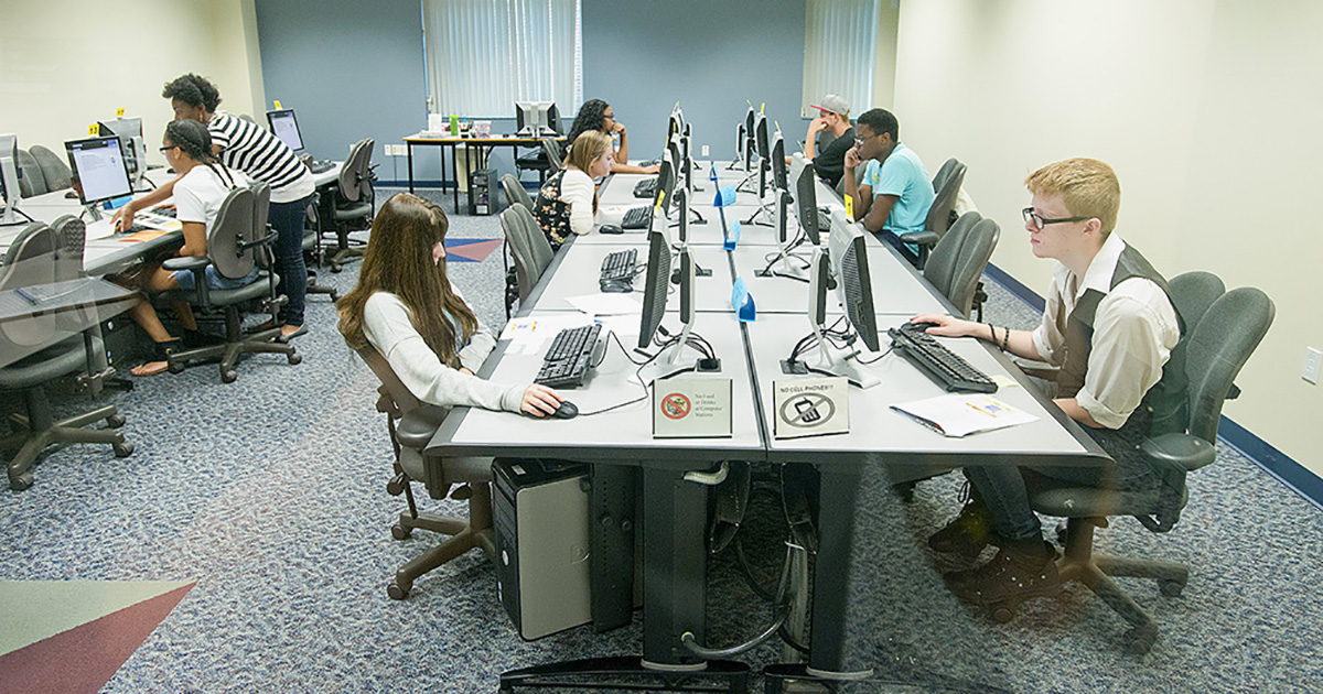 Students take tests on computers in the Testing and Assessment lab.