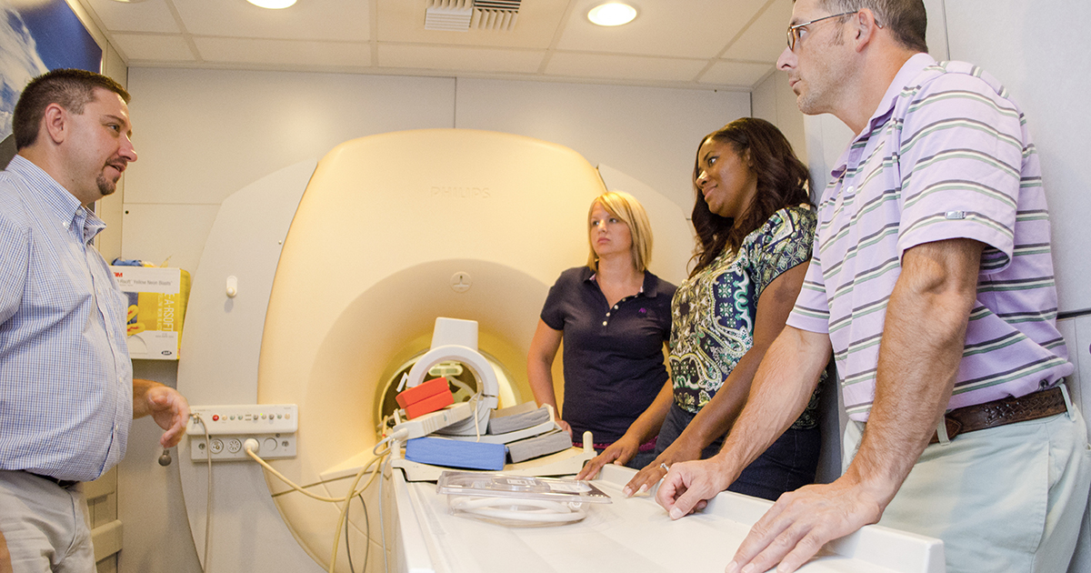 MRI students learn from an instructor in a mobile MRI unit.