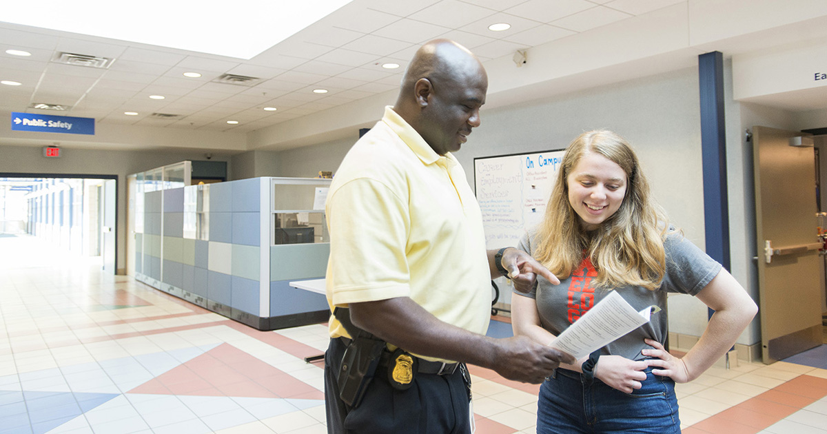 A KCC Public Safety official assists a student on campus.