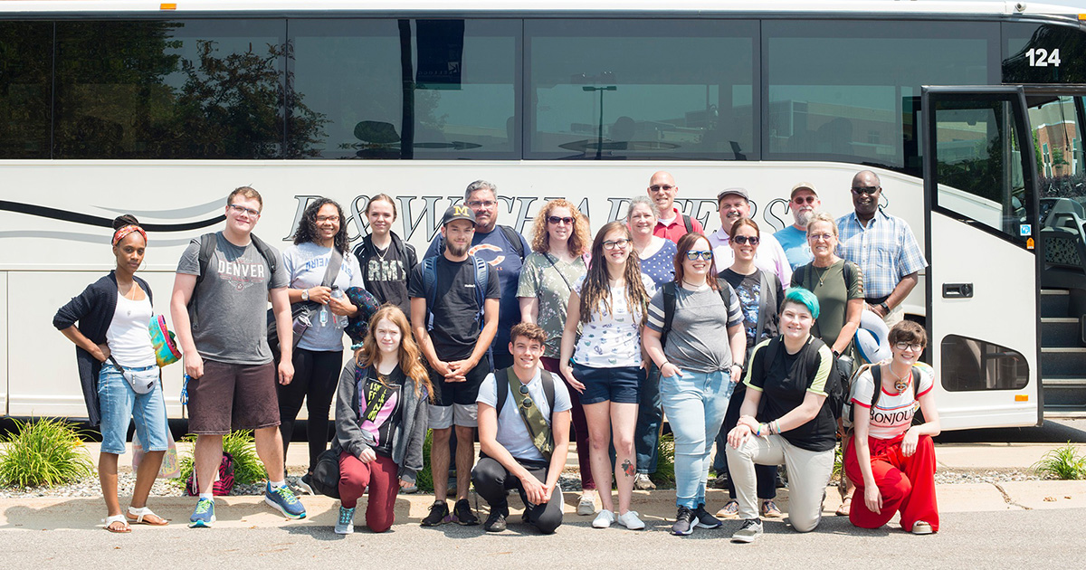 International Travel students pose for a group photo before boarding a bus for the airport.