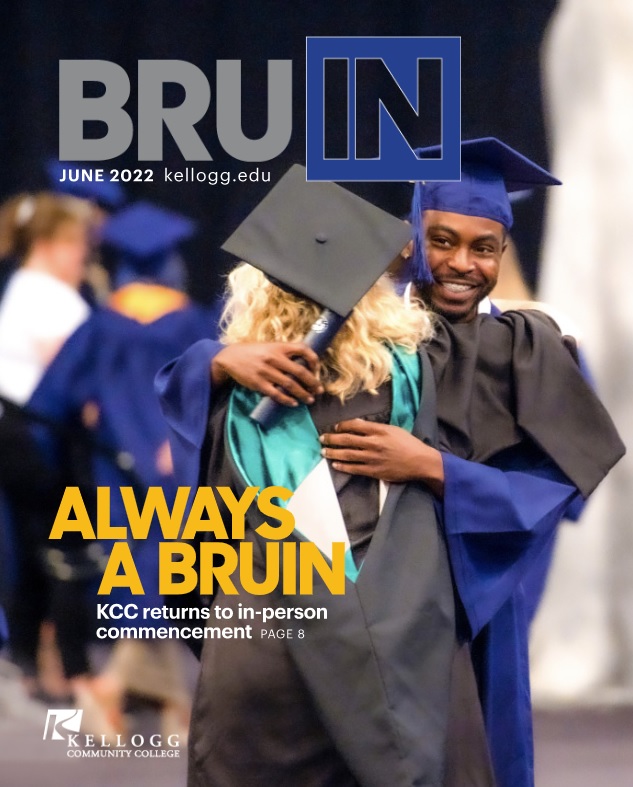 A graduate hugs a faculty member on the June 2022 cover of BruIN magazine.