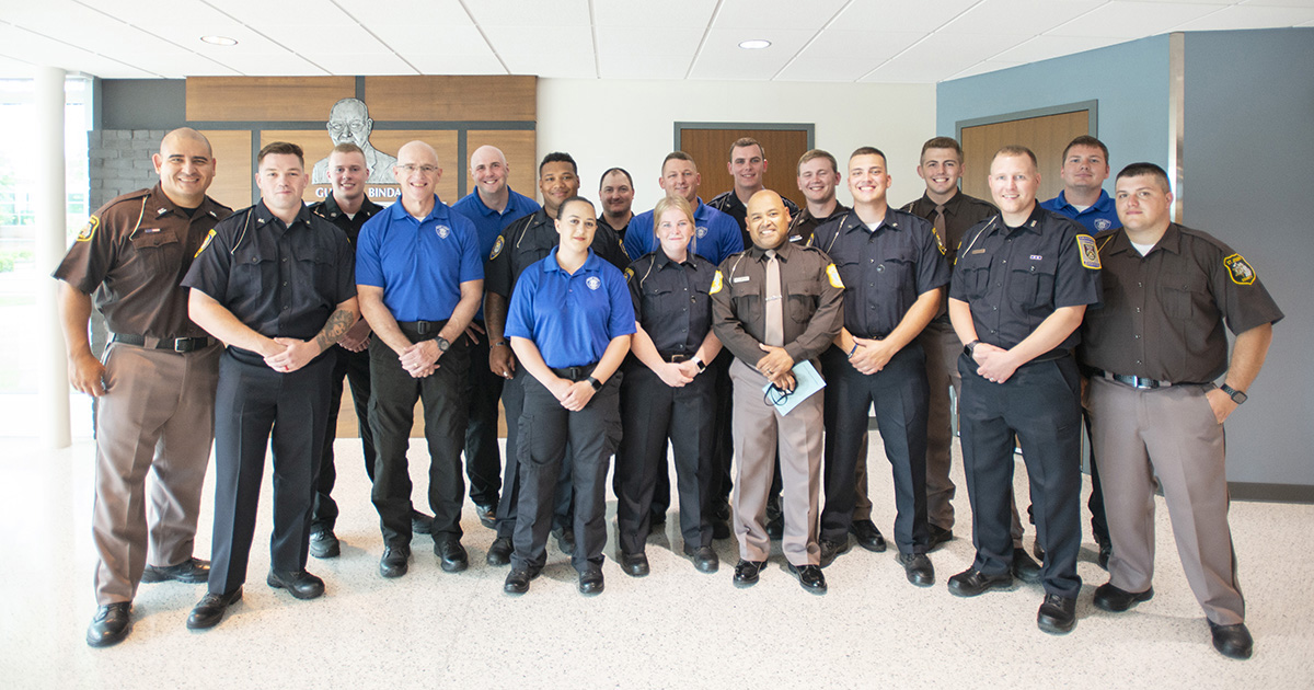 A group photo of KCC Police Academy graduates.