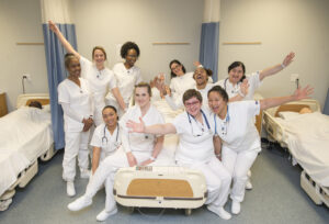KCC CNA students pose for a group photo in a CNA Lab.