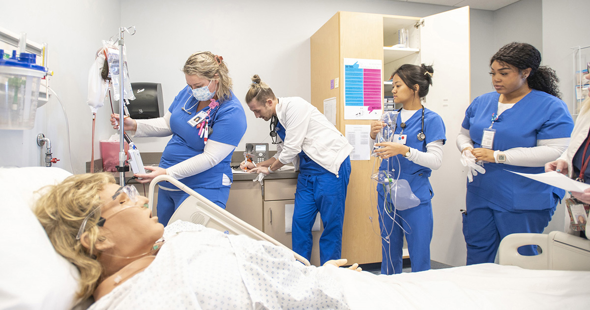 Nursing students participate in exercises in a simulation lab.